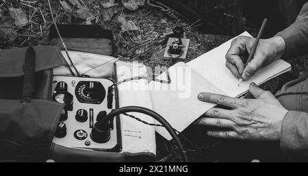 Russian Soviet Infantry Red Army Soldier In World War II using Russian Soviet Portable Radio Transceiver In Trench Entrenchment In Spring Autumn Stock Photo