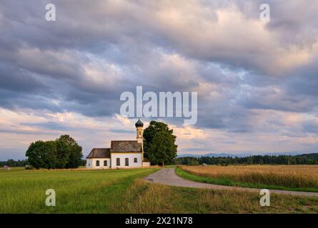 Cloudy sky over St. John the Baptist on a summer evening, Raisting, Weilheim, Bavaria, Germany, Europe Stock Photo