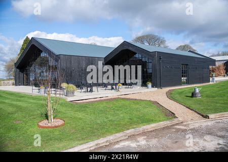 the-entrance-to-a-farmhouse-barn-for-a-wedding-ceremony-service-at