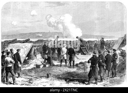 The War in Denmark: Prussian battery at Gaasberg Point, opposite the forts of D&#xfc;ppel, 1864. '...We see two of the great guns at work, throwing shot and shell across the waters of the Venning Bund, a distance of about two miles and a half, into the Danish redoubts, three or four of which are plainly distinguished on the opposite shore...The D&#xfc;ppel windmill is in the background...An officer, making use of a telescope mounted on a rest, is examining the enemy's movements...The gunners, having just fired off one of their two pieces, are preparing to discharge another. One man is carefull Stock Photo