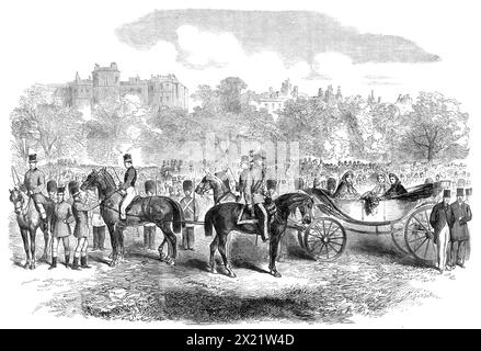The Volunteer Review in Hyde Park [London]: the Princess of Wales and her suite, 1864. '...the Prince and Princess of Wales came not only to witness the affair, but his Royal Highness took an active part in it as commander of his own brigade. This circumstance, with the general popularity of the young couple, as well as the growing interest that is felt in the volunteer movement drew together a...[large] multitude of all ranks and classes of the people...[The engraving shows] the Princess of Wales [future Queen Alexandra], with Princess Alice, and Princess Mary of Cambridge, in an open barouch Stock Photo