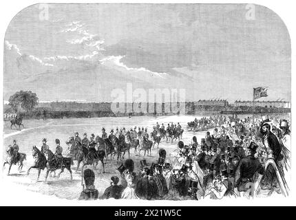 The Volunteer Review in Hyde Park [London]: general view, 1864. '...the Prince and Princess of Wales came not only to witness the affair, but his Royal Highness took an active part in it as commander of his own brigade. This circumstance, with the general popularity of the young couple, as well as the growing interest that is felt in the volunteer movement drew together a...[large] multitude of all ranks and classes of the people...[The engraving shows] the Prince [future King Edward VII] with his immediate companions as they...passed in front of the seats reserved for spectators... As soon as Stock Photo