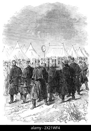The National Rifle Association prize meeting at Wimbledon: the picket going camp rounds, 1865. View of '...the nightly picket of members of the Victoria Rifle Corps, fully accoutred and armed, going the round of the camp, as they did, with strict military precision, an hour or two before the usual bed-time'. From &quot;Illustrated London News&quot;, 1865. Stock Photo