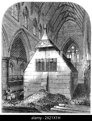 Temporary church within St. Michael and All Angels, Shoreditch, [London], 1865. A '...view of the interior as it appeared a few months ago, while the work of its construction was going on over the temporary building in which the services of the Church have been carried on during the last two years. We believe the only known precedent for this singular expedient of placing the temporary church in the midst of the rising walls of the intended permanent edifice is to be found in the history of the building of York Minster. Architecturally, it is perhaps one of the finest churches lately built in Stock Photo