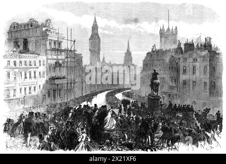 The Funeral of Lord Palmerston: the procession passing Charing-Cross, [London], 1865. 'Our Illustration shows the aspect of the procession at Charing-cross as it turned to go down Whitehall, the vast open space on the south side of Trafalgar-square being thronged with an immense assemblage of spectators, who could have a view from behind of nearly the entire procession at once, when its rear had got well out of Cockspur-street...The route was along Piccadilly, down St. James's-street, along Pall-mall to Charing-cross, down Whitehall and Parliament-street, to the Broad Sanctuary in front of the Stock Photo