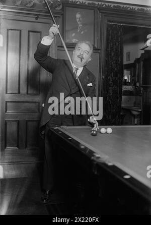 Victor Herbert, between c1915 and c1920. Shows composer and cellist Victor August Herbert (1859-1924) playing pool. Herbert was one of the founders of the American Society of Composers, Authors, and Publishers (ASCAP). Stock Photo