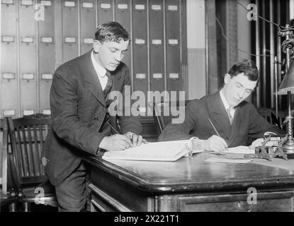 Two new citizens sign naturalizaton papers in judge's chambers, 1910. Stock Photo
