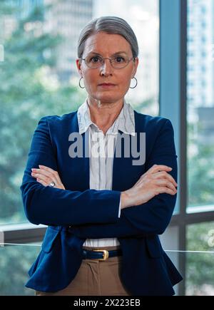 Arms crossed, portrait or mature businesswoman ready for professional mindset, ambition or empowerment. Office, corporate worker and face of manager Stock Photo