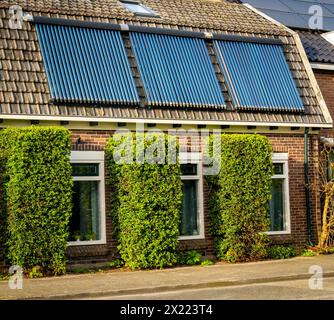 Vacuum collectors on the roof, solar water heating system Stock Photo