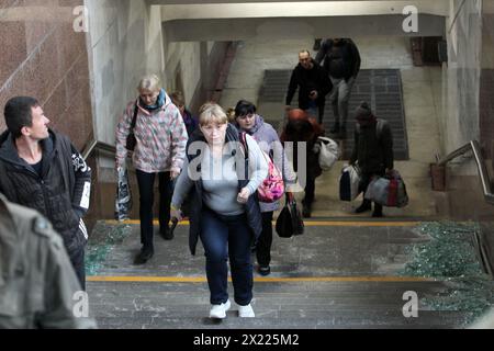 Non Exclusive: DNIPRO, UKRAINE - APRIL 19, 2024 - People come out of an underpass near the residential building damaged by the Russian missile attack, Stock Photo