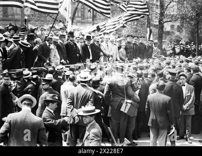 Gaynor addressing Olympic Athletes, 1912. Showing Mayor William J. Gaynor and others at a parade greeting the U.S. athletes who competed in the 5th Olympic Games, held in Stockholm, Sweden in 1912. In the reviewing stand are Dr. George F. Kunz (in top hat) and (left to right from Kunz), Mayor William Gaynor; U.S. Olympic Commissioner James Edward Sullivan (1862-1914) and Justice Victor J. Dowling (1866-1934). Stock Photo