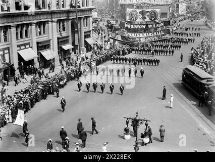 Parade in honor of Olympic victors, 1912. Showing a parade in New York City, near Madison Square Park, for the 5th Olympic Games, held in Stockholm, Sweden, in 1912. Large banner advertises the National Democratic headquarters, with presidential candidate Woodrow Wilson and running mate Thomas Marshall. Stock Photo