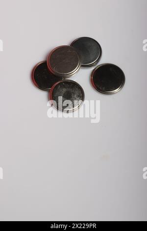 Used tablet batteries on a white background. Stock Photo