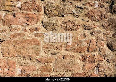 Red-brown Plastered Brick Wall in Bright Sunlight. sun, sunny, light, aged, vintage, texture, textured, urban, structure, city, house, facade, rustic Stock Photo
