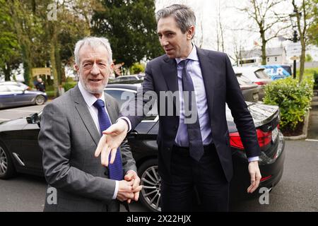 Taoiseach Simon Harris (right) with Leader of Fine Gael in the European Parliament Seán Kelly MEP, as he arrives to attend the European People's Party conference on the future of European agriculture at the Woodford Dolmen Hotel, Co. Carlow. The Taoiseach has said he is “eager to be in a position to apologise” to the families of those killed in the Stardust fire tragedy. Families of the 48 young people who died in the blaze that ripped through the nightclub in north Dublin in 1981 have called for an official state apology. Picture date: Friday April 19, 2024. Stock Photo