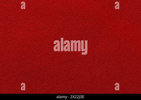 Dark red fabric cloth texture as background. Stock Photo
