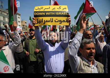 April 19, 2024, Tehran, Iran: An Iranian man carries a placard written ''DOWN WITH ISRAEL'' during an anti-Israel rally in Tehran. Air defense systems over the central city of Isfahan destroyed three aerial objects early on April 19. The explosions come after a drone and missile attack carried by Iran's Islamic Revolutionary Guards Corps (IRGC) towards Israel on April 13, following an airstrike on the Iranian embassy in Syria, which Iran claimed was conducted by Israel.Credit: Zuma Press/Alamy Live News Stock Photo