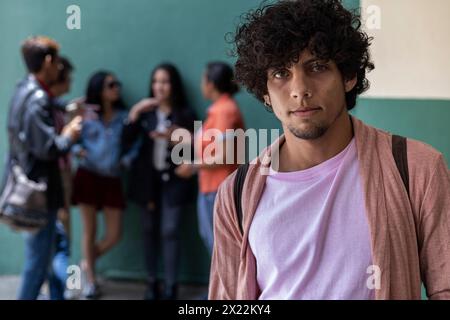 Group of young Latin American university students gathered outside class, close-up focus Stock Photo