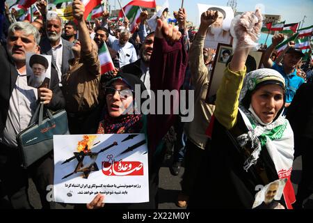 April 19, 2024, Tehran, Iran: Iranians carrying placards chant slogans during an anti-Israel rally in Tehran. Air defense systems over the central city of Isfahan destroyed three aerial objects early on April 19. The explosions come after a drone and missile attack carried by Iran's Islamic Revolutionary Guards Corps (IRGC) towards Israel on April 13, following an airstrike on the Iranian embassy in Syria, which Iran claimed was conducted by Israel.Credit: Zuma Press/Alamy Live News Stock Photo