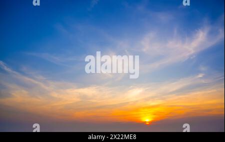 Colorful cirrus cloudy sky at sunset. Gradient warm cold color. Sky texture, abstract nature background. Stock Photo