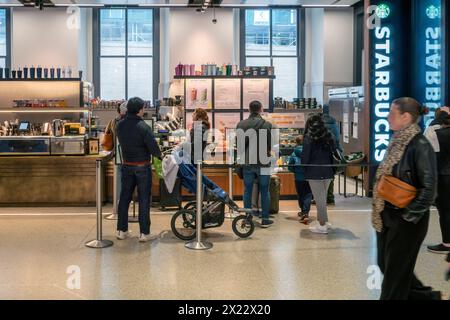 A branch of Starbucks in the Moynihan Train Hall at Penn Station in New York on Saturday, April 13, 2024. (© Richard B. Levine) Stock Photo