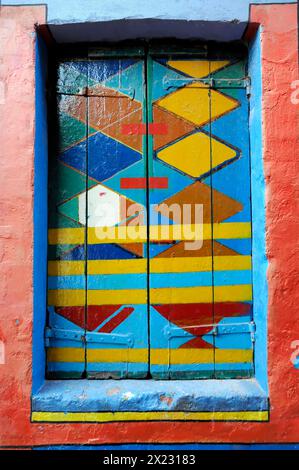 Colourful houses, Burano, Burano Island, Abstract artwork on a window with bright colours and geometric shapes, Burano, Venice, Veneto, Italy Stock Photo