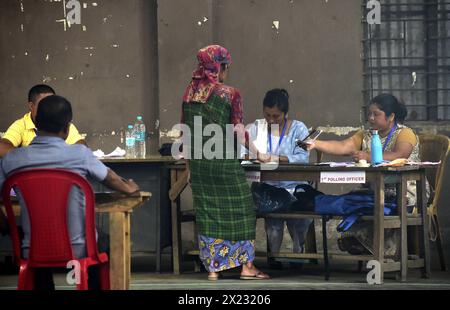 Guwahati, Guwahati, India. 19th Apr, 2024. A woman voter verify her document before casting her vote in the 1st phase of India General Election 2024 in a polling station in Re Bhoi district of Meghlaya India on Friday 19th April 2024 (Credit Image: © Dasarath Deka/ZUMA Press Wire/Alamy Live News) EDITORIAL USAGE ONLY! Not for Commercial USAGE! Stock Photo