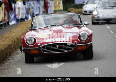 A red Jaguar E-Type convertible drives on a closed-off race track, SOLITUDE REVIVAL 2011, Stuttgart, Baden-Wuerttemberg, Germany Stock Photo