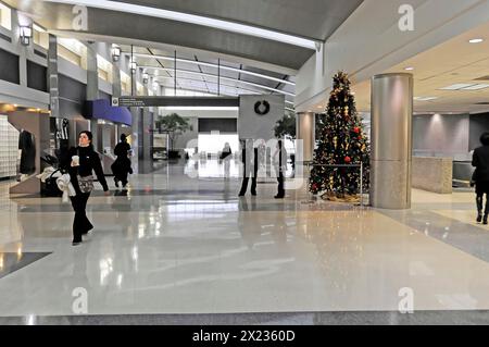 AUGUSTO C. SANDINO Airport, Managua, Nicaragua, Spacious lobby of an airport with a Christmas tree and a wall clock, Central America, Central America Stock Photo