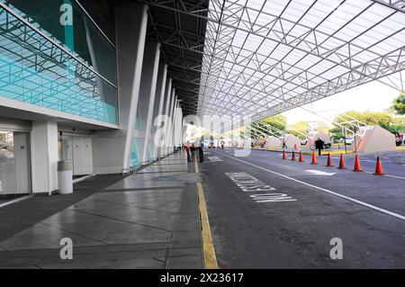 AUGUSTO C. SANDINO Airport, Managua, The entrance of an airport with pedestrians and an area for taxis, Nicaragua, Central America, Central America Stock Photo
