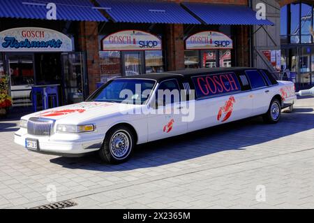 List, harbour, Sylt, North Frisian island, white GOSCH stretch limousine parked in front of a building, sun shining on the luxury car, Sylt Stock Photo