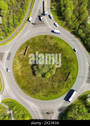 Pontypridd, Wales - 18 April 2024: Drone overhead view of traffic driving around a roundabout on the Church Village bypass Stock Photo