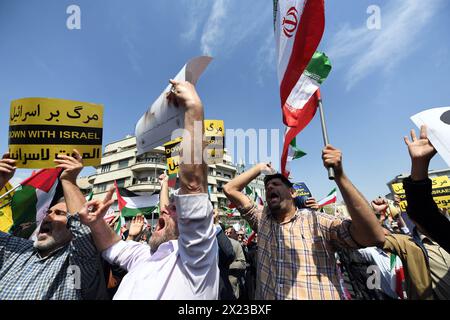 Tehran, Iran. 19th Apr, 2024. Demonstrators attend a rally in Tehran, Iran, April 19, 2024. Iranians on Friday staged nationwide rallies to express support for the country's retaliatory strikes against Israeli targets last week, the official news agency IRNA reported. Credit: Shadati/Xinhua/Alamy Live News Stock Photo