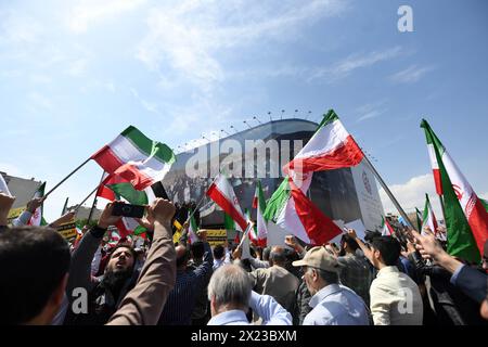 Tehran, Iran. 19th Apr, 2024. Demonstrators attend a rally in Tehran, Iran, April 19, 2024. Iranians on Friday staged nationwide rallies to express support for the country's retaliatory strikes against Israeli targets last week, the official news agency IRNA reported. Credit: Shadati/Xinhua/Alamy Live News Stock Photo