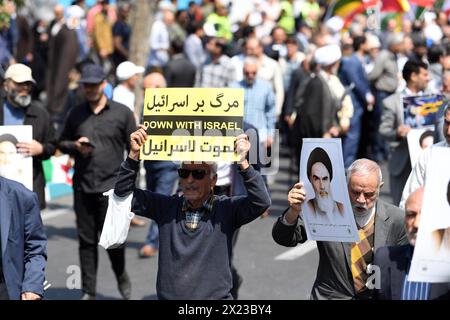 Tehran, Iran. 19th Apr, 2024. Demonstrators march during a rally in Tehran, Iran, April 19, 2024. Iranians on Friday staged nationwide rallies to express support for the country's retaliatory strikes against Israeli targets last week, the official news agency IRNA reported. Credit: Shadati/Xinhua/Alamy Live News Stock Photo