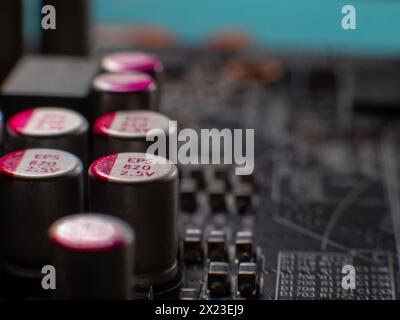 A close-up of a printed circuit board and small components, of which there is a severe shortage in industry Stock Photo