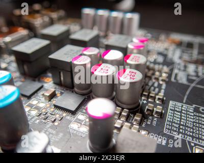 A close-up of a printed circuit board and small components, of which there is a severe shortage in industry Stock Photo