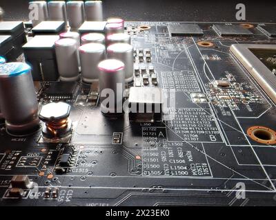 A close-up of a printed circuit board and small components, of which there is a severe shortage in industry Stock Photo