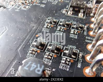 A close-up of a printed circuit board and small components, of which there is a severe shortage in industry Stock Photo