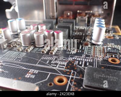 A close-up of a printed circuit board and small components, of which there is a severe shortage in industry Stock Photo