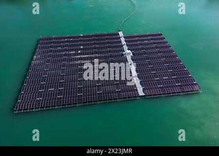 Floating platform with solar panels of a solar farm or solar park on the water of a lake Stock Photo