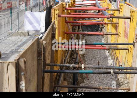 Civil engineering trench fully equipped with shoring for safety reasons. Stock Photo