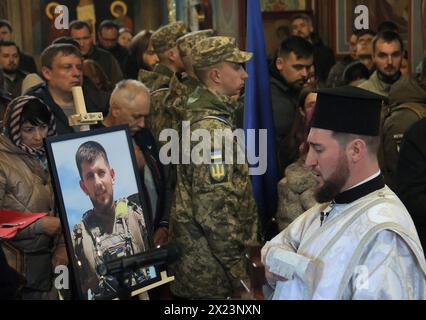 KYIV, UKRAINE - APRIL 19, 2024 - The portrait of Sergeant of the 59th Brigade Pavlo Petrychenko who perished while defending Ukraine from Russian troops is pictured during the memorial service at St Michael’s Golden-Domed Cathedral, Kyiv, capital of Ukraine. Ukrainian serviceman and activist Pavlo Petrychenko was a sergeant in the 59th Separate Motorized Infantry Brigade and the author of the petition that urged to limit online casinos for military personnel during martial law, which garnered the 25,000 votes needed to be considered by the President within hours of its publication. News of Pet Stock Photo