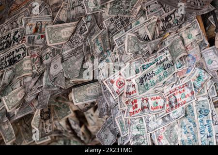 Dollar Bills pinned to bar wall Stock Photo