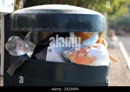 Overflowing trashcan, pollution in the city, overflowing waste, litter. Stock Photo