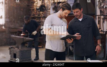 Business man, tablet and partner in warehouse for planning logistics, doing inventory and ecommerce. Male people, factory and teamwork with tech Stock Photo