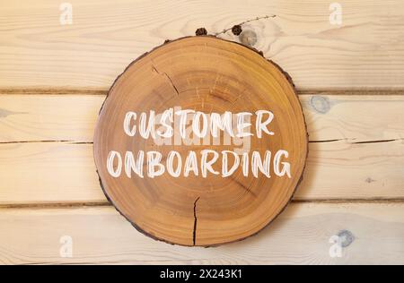 Customer onboarding symbol. Concept words Customer onboarding on beautiful wooden circle. Beautiful wooden wall background. Business Customer onboardi Stock Photo