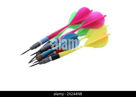 Colorful darts stuck with plastic feathers isolated on white background. Stock Photo