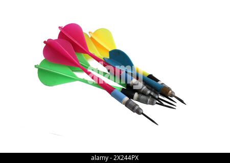Colorful darts stuck with plastic feathers isolated on white background. Stock Photo