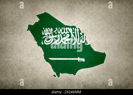 Grunge map of Saudi Arabia with its flag printed within its border on an old paper. Stock Photo